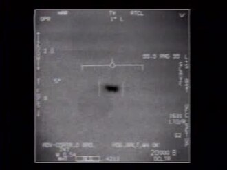 Frame from the official FLIR1 Navy infrared video showing a small dark target and sensor symbology.