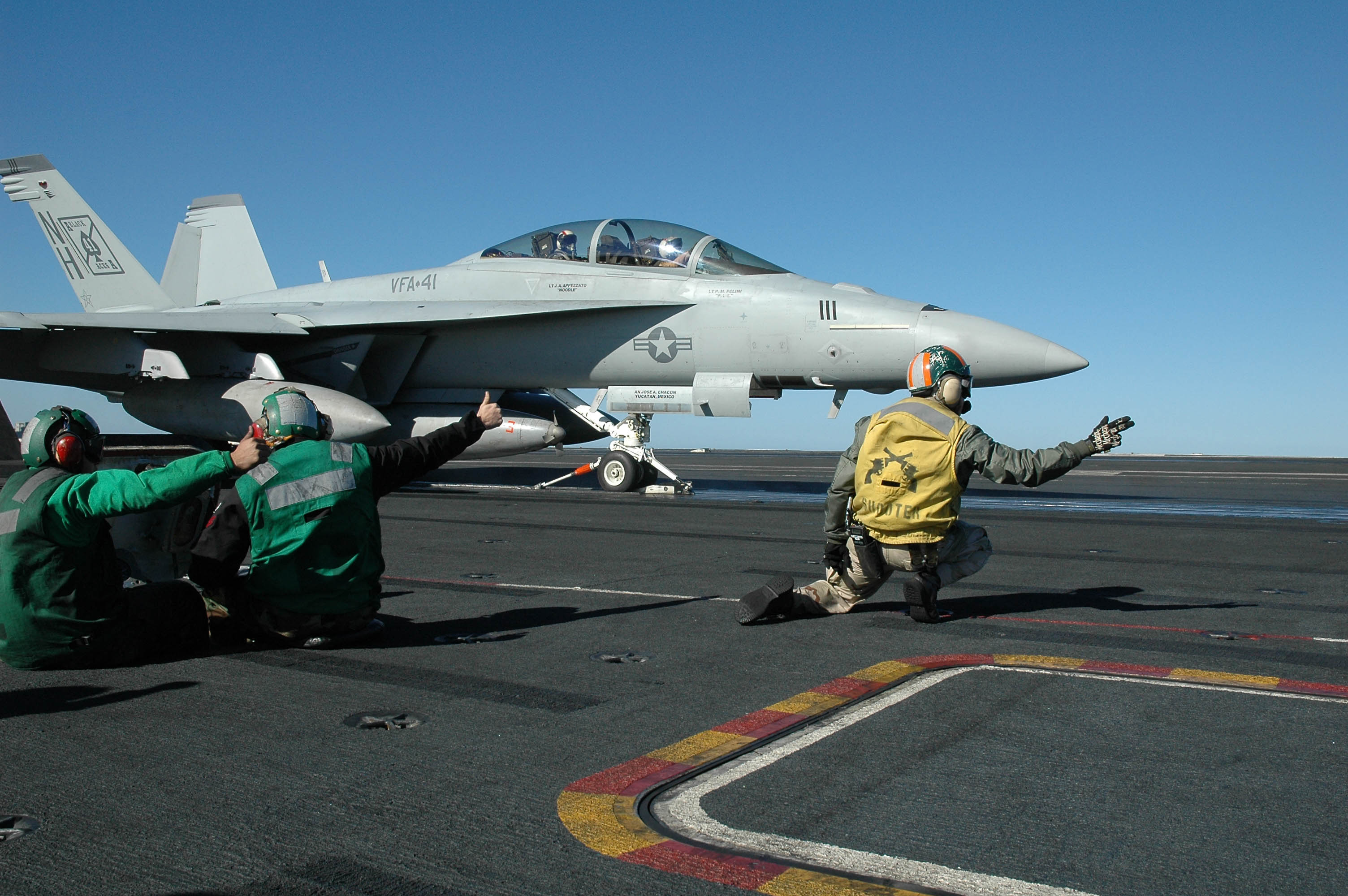 A VFA-41 F/A-18F Super Hornet launching from USS Nimitz in December 2004.